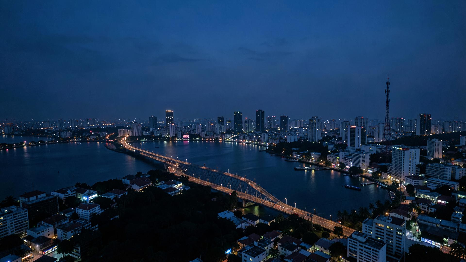 Nigerian city skyline at dusk with communication infrastructure